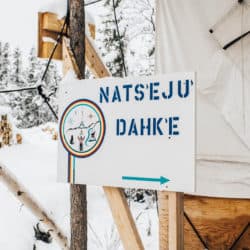 A painted sign that says "Nats'eju Dahk'e", which means “A place of healing” in the North Slavey language.