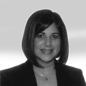Nujma Bond with a bob haircut smiling