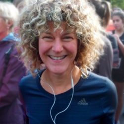 Diane Berard with lively curly hair smiling