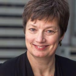 Margaret Mason with short hair smiling