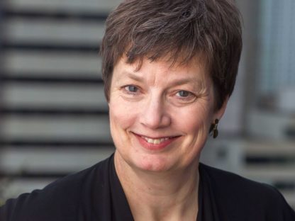 Margaret Mason with short hair smiling
