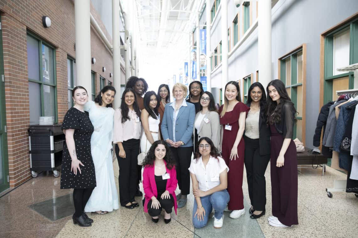 Girls Belong Here youth ambassadors gather with Plan International Canada President and CEO Lindsay Glassco during a celebration event for Girls Belong Here participants
