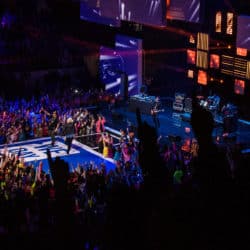 Picture of a WE Day event with large crowd and performers on stage.